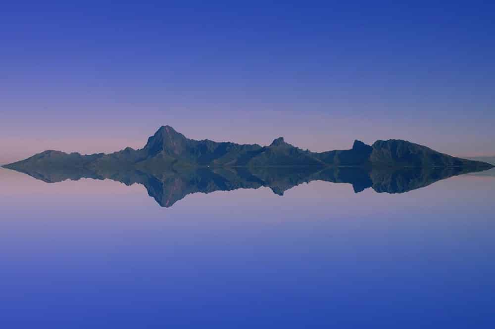 Rising sun over Moorea. Photo Pierre Lesage